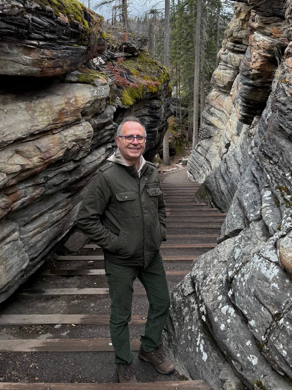 Matt, Edmonton photographer, smiling on a trail between rock formations