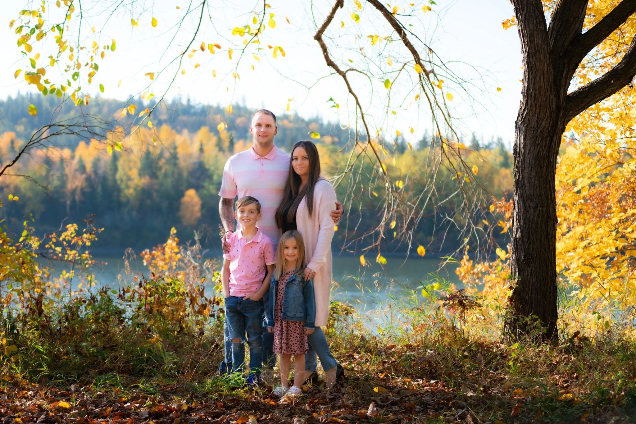 Family portrait outdoors in Edmonton river valley during fall colors